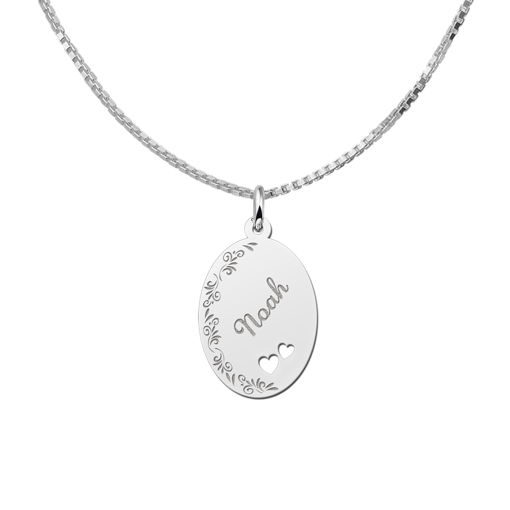Colgante ovalado de plata borde floral & dos corazones
